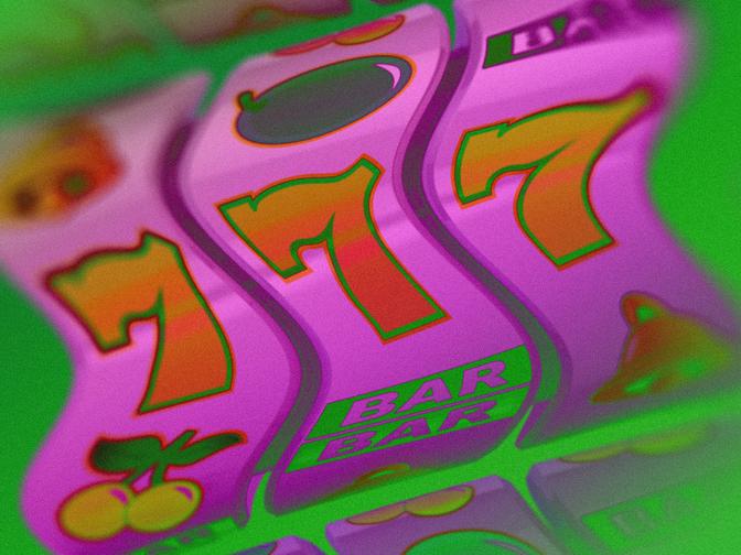 Nahaufnahme eines Spielautomaten in leuchtende Farben und verschwommene Details.